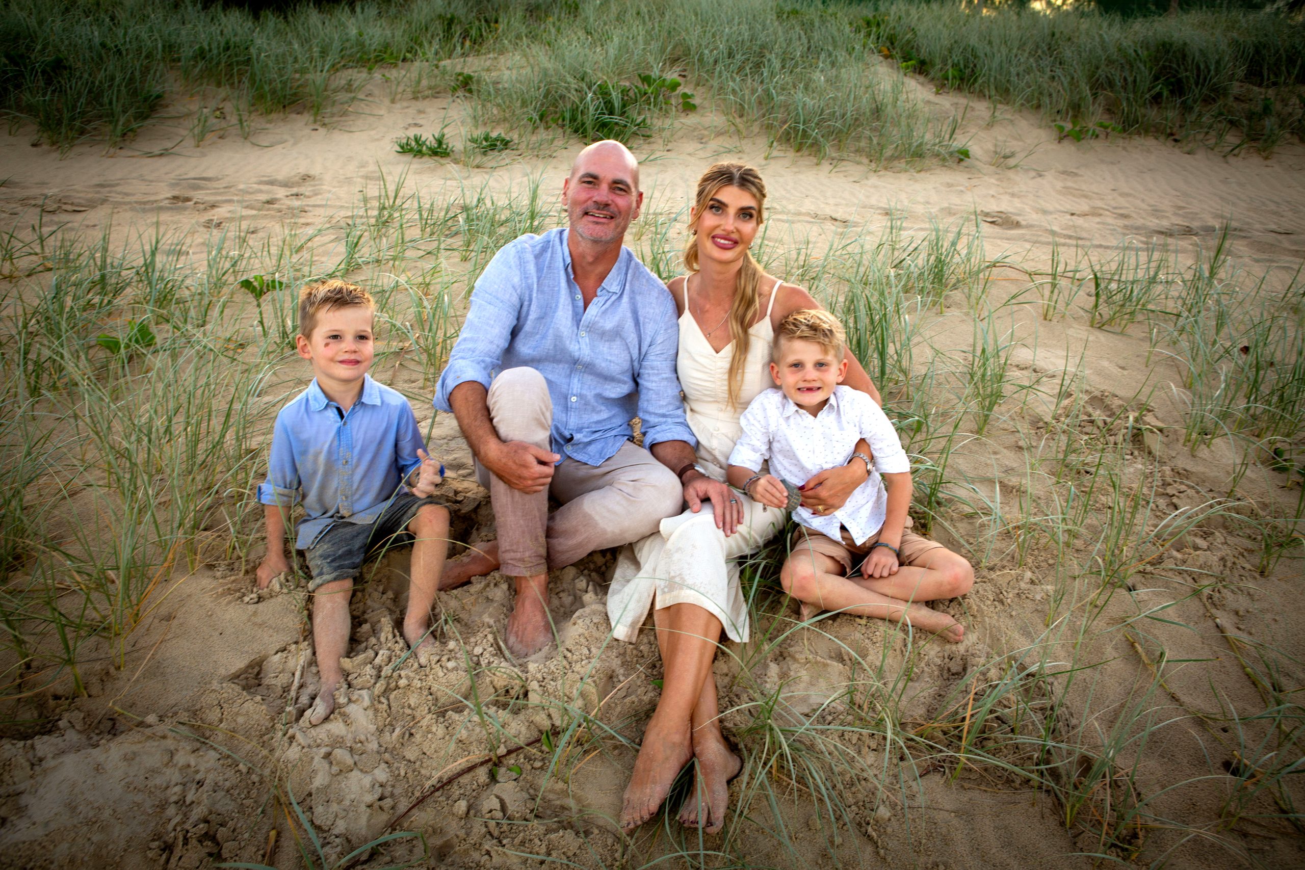 Family of 4 photograph on beach grass